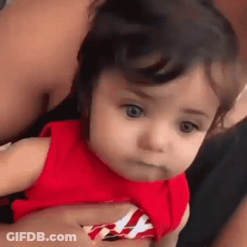 Baby Girl In Red Dress Being Held GIF