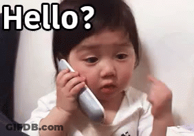 Baby Girl Talking On Cell Phone Making Funny Face GIF