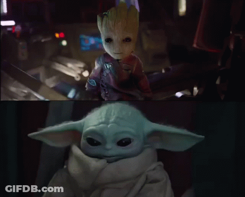 Baby Groot And Baby Yoda Sitting Together In Dark Room GIF