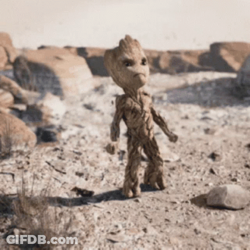 Baby Groot From Guardians Of The Galaxy Standing In Desert GIF