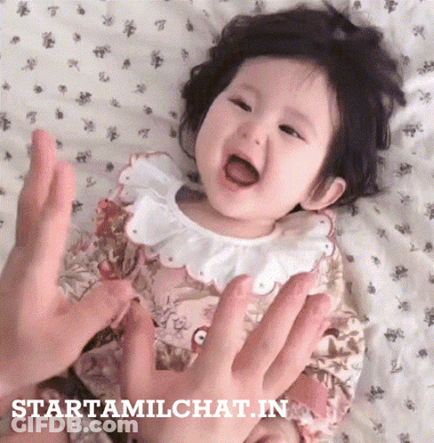 Baby Held By Person With Starttamilchat.in Visible GIF
