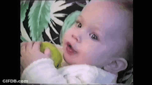 Baby Holding And Eating Green Apple GIF