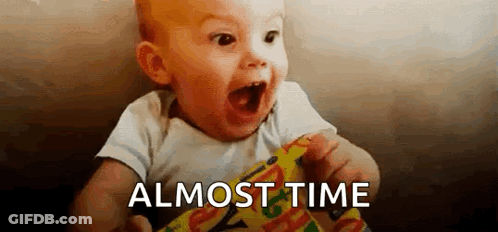 Baby Holding Candy Bar Saying Almost Time GIF