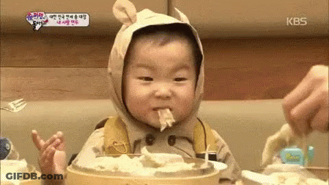 Baby In Bear Costume Eating Noodles GIF