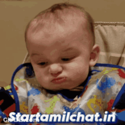 Baby In Bib In High Chair With Starttamilchat.in GIF