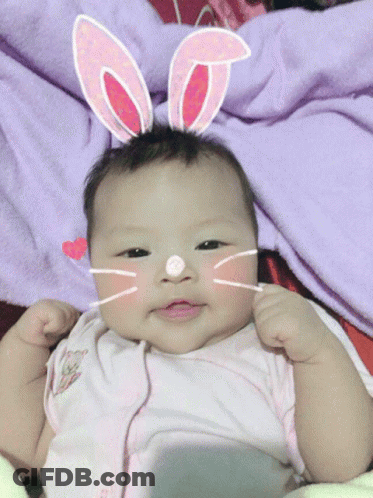 Baby In Bunny Ears And Cat Face Mask GIF