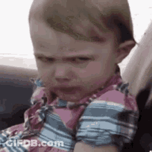 Baby In Car Seat Making Funny Face GIF