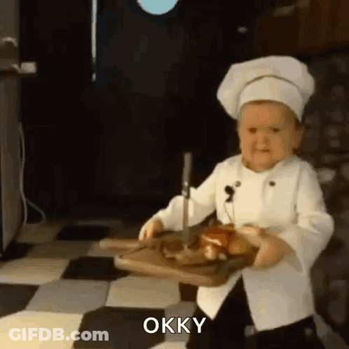 Baby In Chef's Hat Holding Cutting Board And Knife GIF