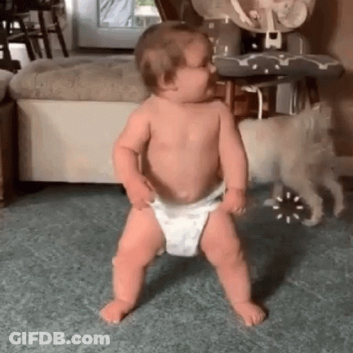 Baby In Diaper Dancing While Dog Watches GIF