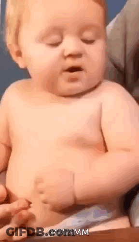 Baby In Diaper Sitting With Eyes Closed GIF