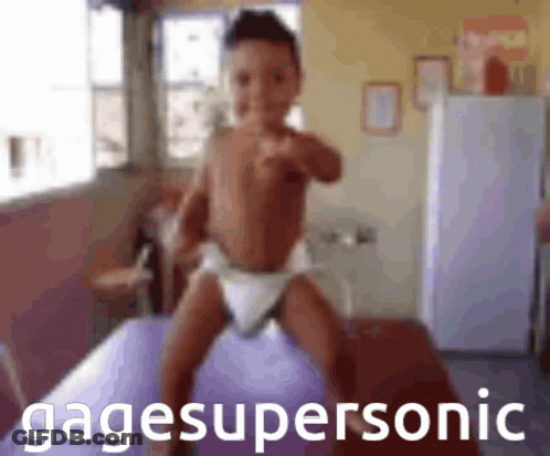 Baby In Diaper Standing On Purple Ball Gagesupersonic GIF