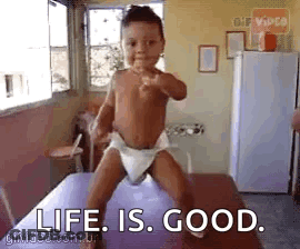 Baby In Diaper Standing On Table Saying Life Is Good GIF