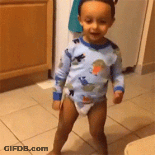 Baby In Diaper Standing On Tiled Floor GIF