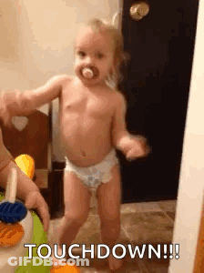 Baby In Diapers Dancing With Pacifier GIF