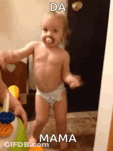 Baby In Diapers Dancing With Person Holding Toy GIF