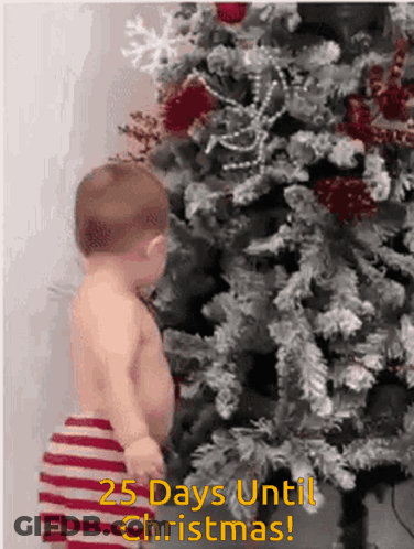 Baby In Front Of Christmas Tree Saying 25 Days Until Christmas GIF