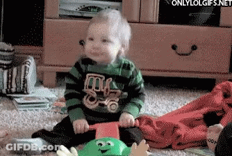 Baby In Green And Black Striped Shirt With Truck GIF