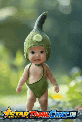 Baby In Green Costume With Cucumber Hat Saying Star Tamilchat.in GIF