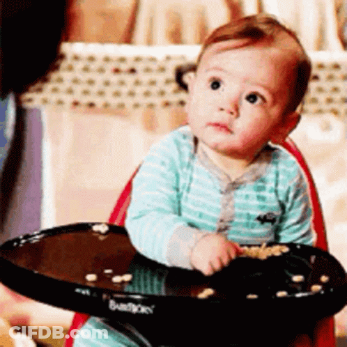 Baby In High Chair With Food Tray GIF