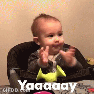 Baby In High Chair With Hands Up Saying Yaaaay GIF