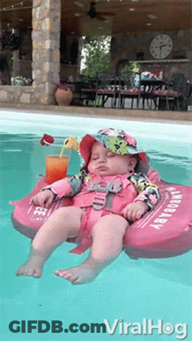 Baby In Life Preserver Floating GIF
