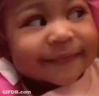 Baby In Pink Hat Making Funny Face GIF