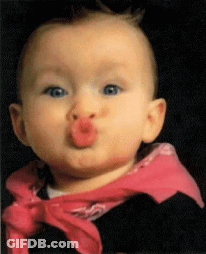 Baby In Pink Scarf Blowing A Kiss GIF