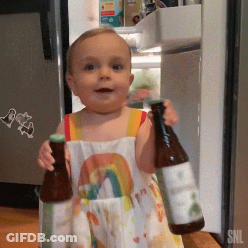 Baby In Rainbow Dress Holding Two Bottles SNL GIF