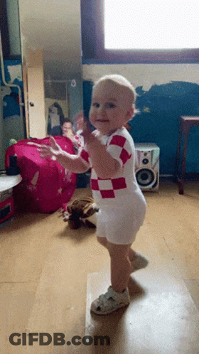 Baby In Red And White Checkered Outfit Dancing GIF