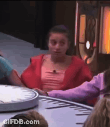 Baby In Red And White Dress On Blue Blanket GIF