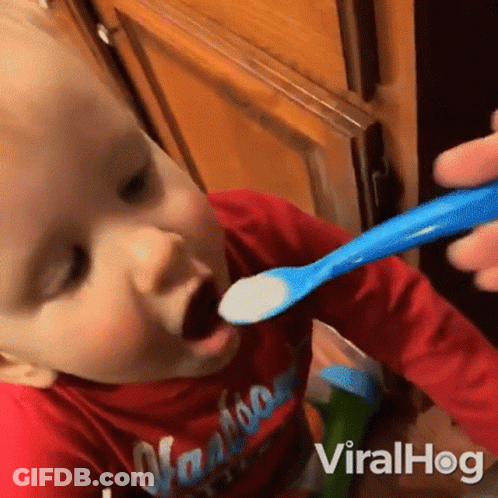 Baby In Red Shirt Fed With Blue Spoon Viralhog GIF
