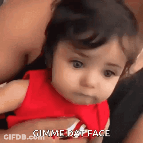 Baby In Red Shirt Making Funny Face GIF