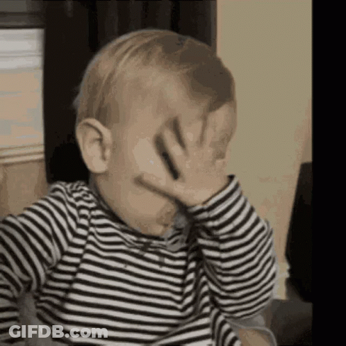 Baby In Striped Shirt Covering Face GIF