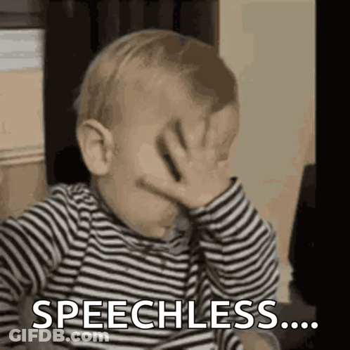 Baby In Striped Shirt Covering Face Speechless GIF