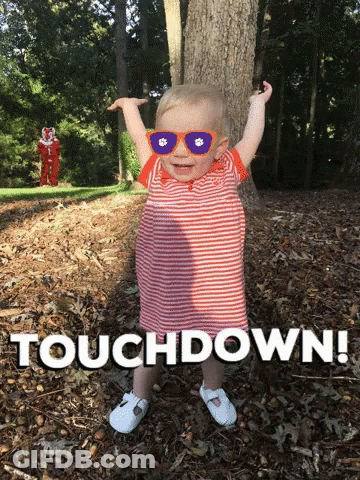 Baby In Sunglasses In Leaves Saying Touchdown GIF