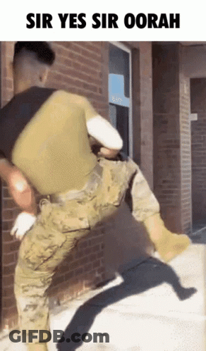 Baby In US Marines Uniform Chewing Crayons GIF