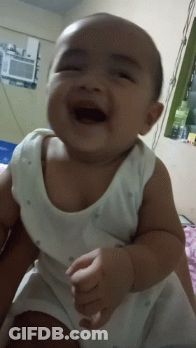 Baby In White Tank Top Laughing With Mouth Open GIF