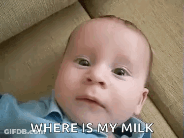 Baby Laying On Couch Making Funny Face GIF