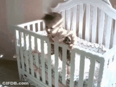 Baby Looking Out Window From White Crib GIF