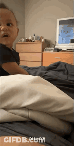 Baby Lying On Bed Saying Oh My GIF