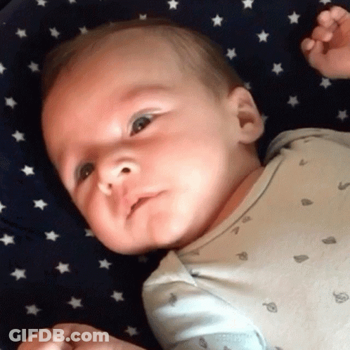 Baby Lying On Starry Blue Blanket GIF