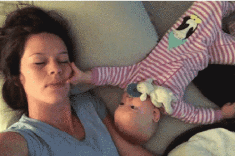 Baby Lying With Mom GIF