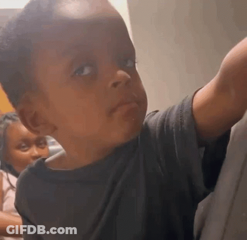 Baby Making Funny Face At Camera GIF
