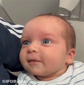 Baby Making Funny Face Being Held GIF