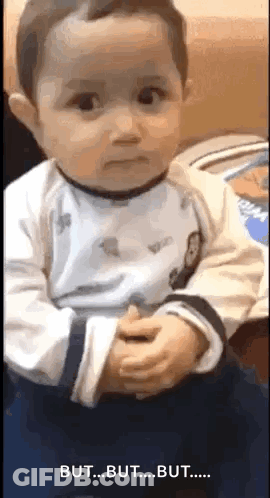 Baby Making Funny Face Holding Hands GIF
