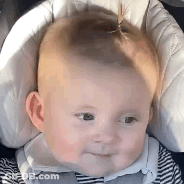 Baby Making Funny Face In Car Seat GIF