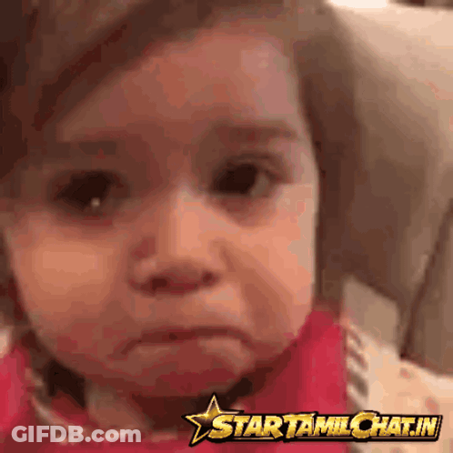 Baby Making Funny Face In Front Of Star Sign GIF
