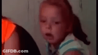 Baby Making Funny Face On Couch GIF