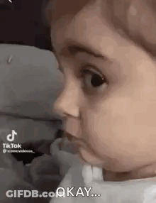 Baby Making Funny Face Saying Okay GIF