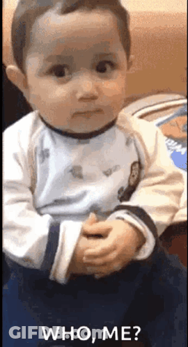 Baby Making Funny Face Saying Who Me GIF